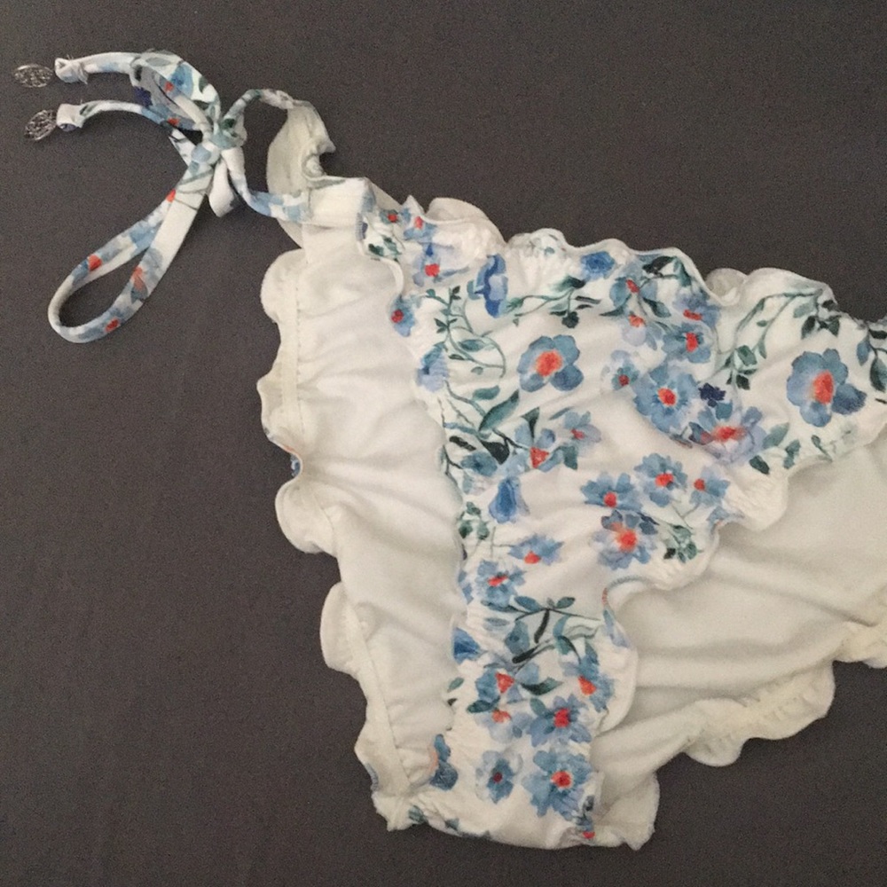 White bathing suit bottom with blue flowers